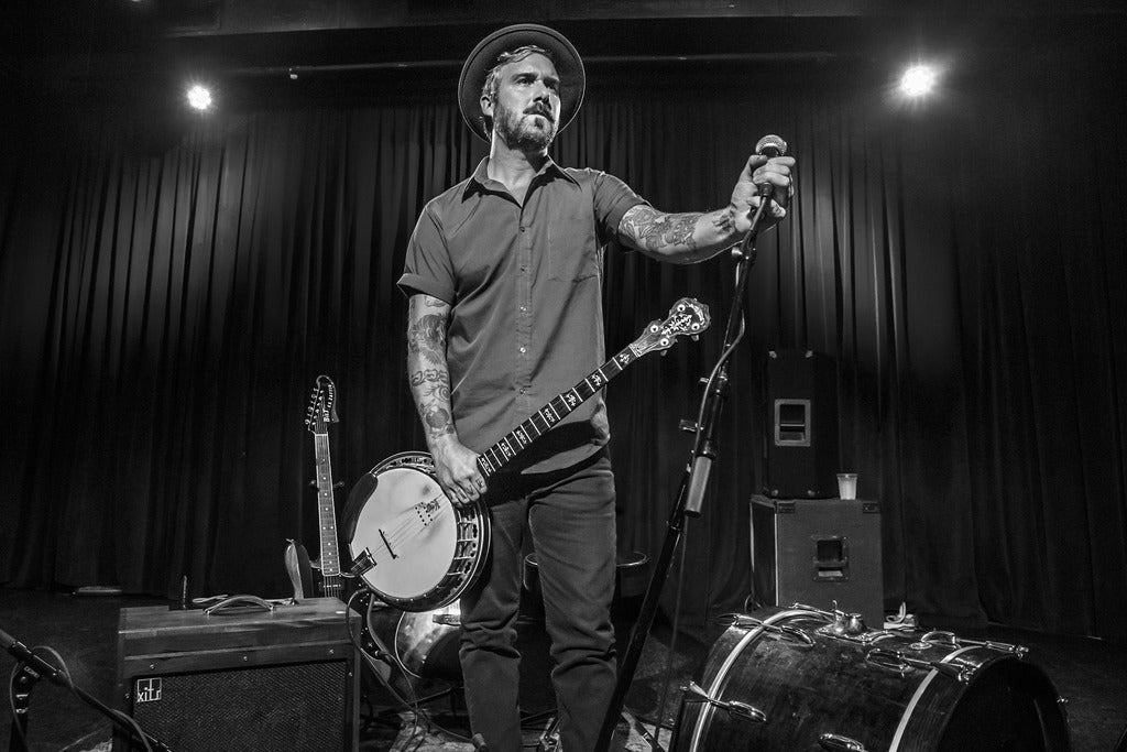 William Elloitt Whitmore w/ guests (partially seated)